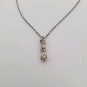 Nina Ricci Rhodium Plated Pendant with Swarovski Crystals - 16-18" length‎